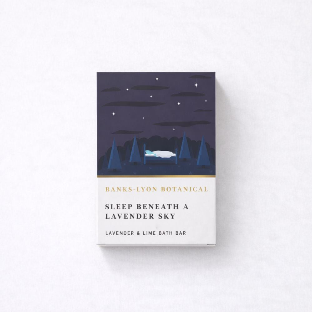 Lavender and Lime bath melt in a cardboard box with an illustration that shows trees and the night sky