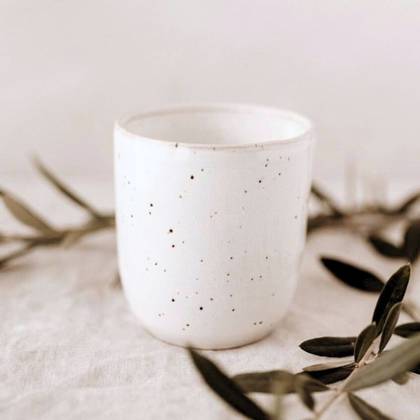 White speckled handleless mug