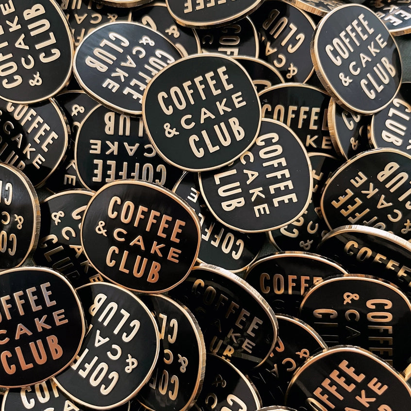 A big pile of coffee and cake club badges