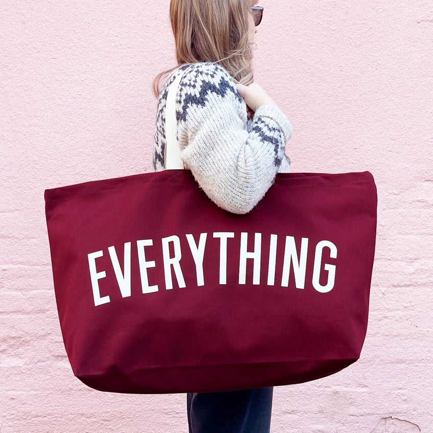 red oversized tote back shown over the shoulder