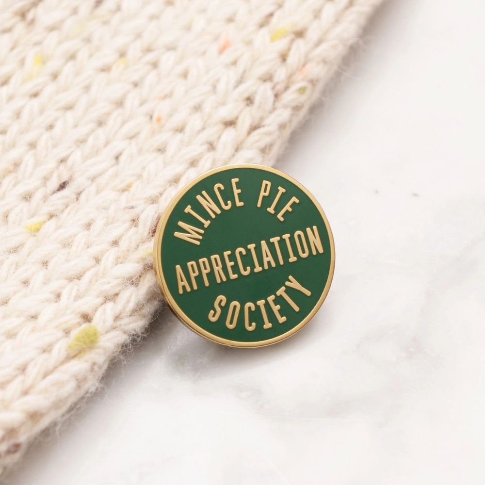 Mince pie appreciation society pin badge in green enanel with gold lettering