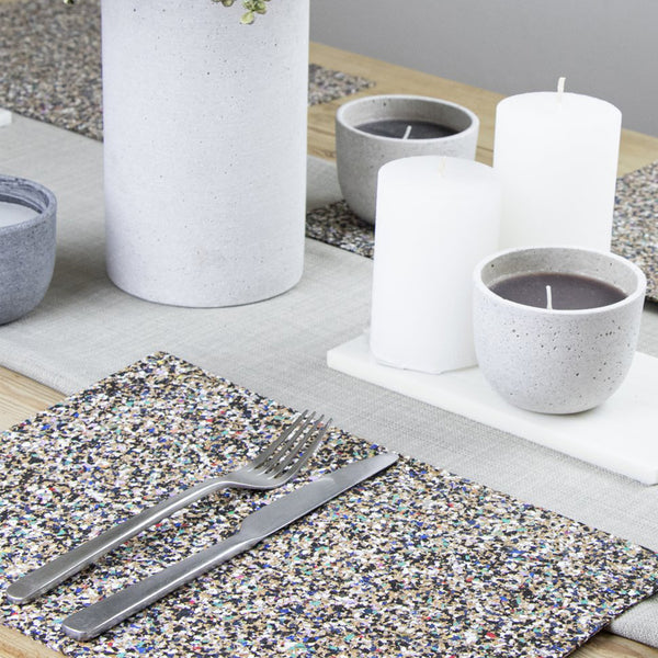 rectangular recycled plastic and cork placemats shown on dinner table