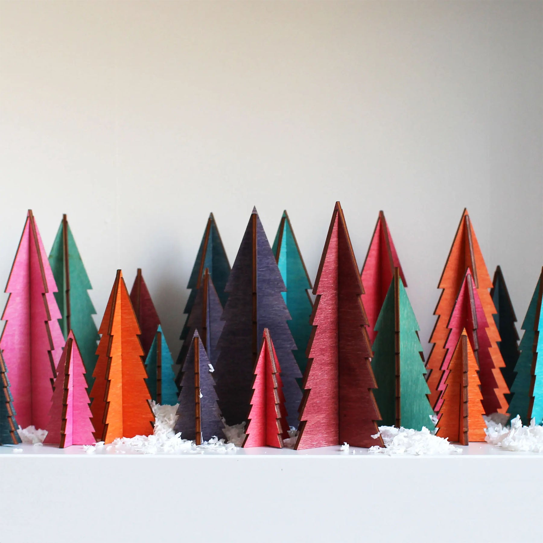 Set of 12 matching colour wood christmas trees