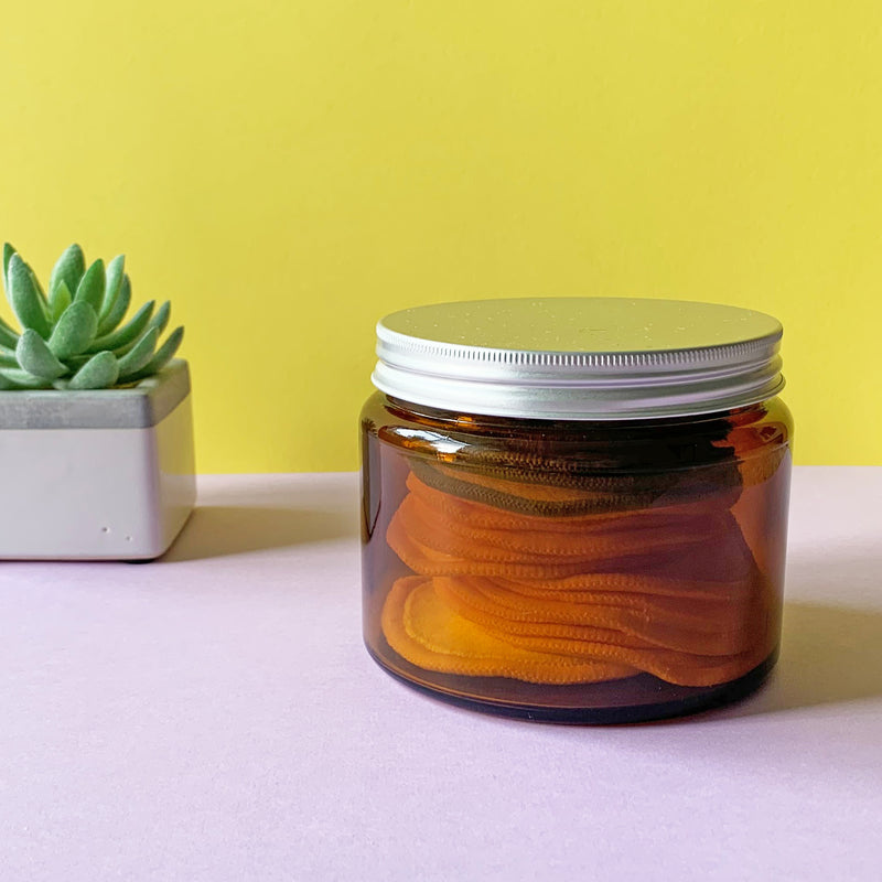 Amber glass storage jar with aluminium lid screwed on