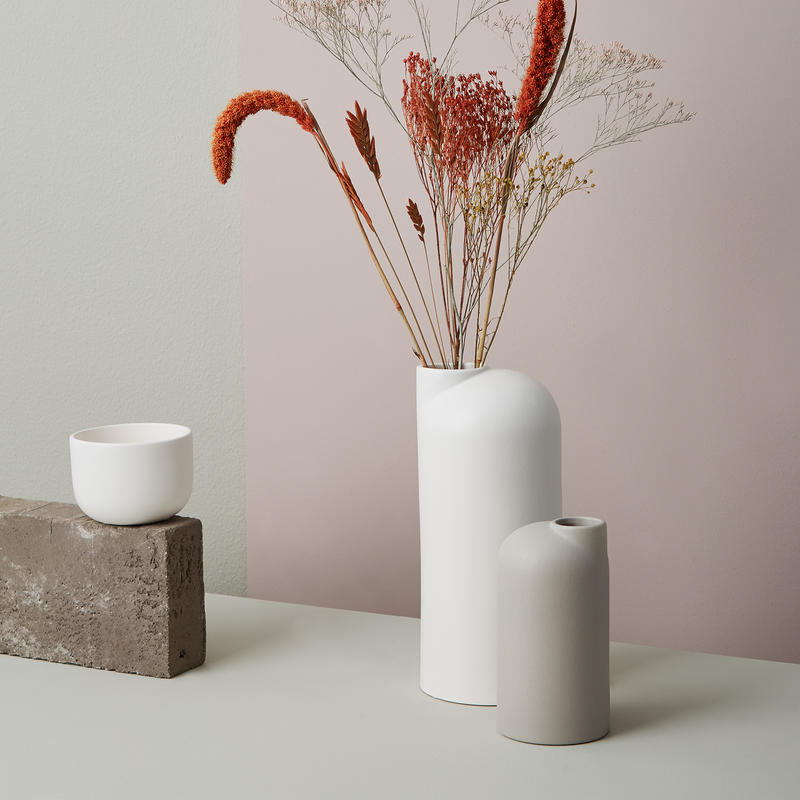 Small taupe scandi vase next to large white one